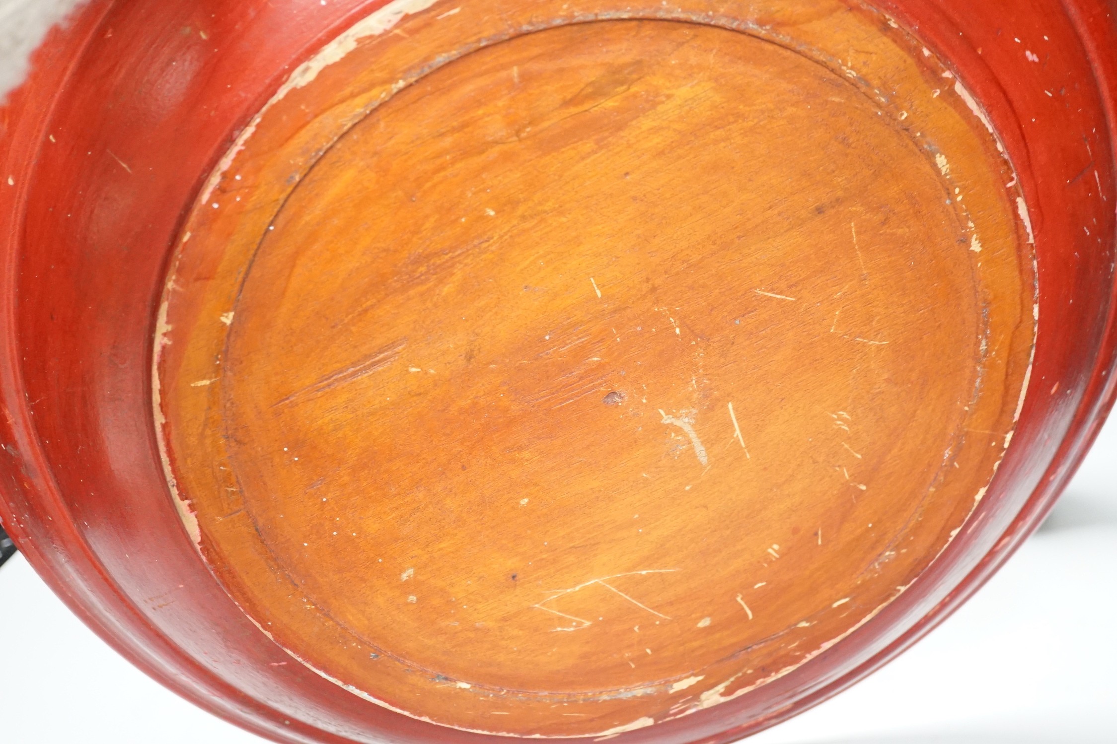 A pair of early 20th century Chinese carved red lacquer and gilt temple incense burners and a similar Asian lacquer dish, dish 44.5cms diameter